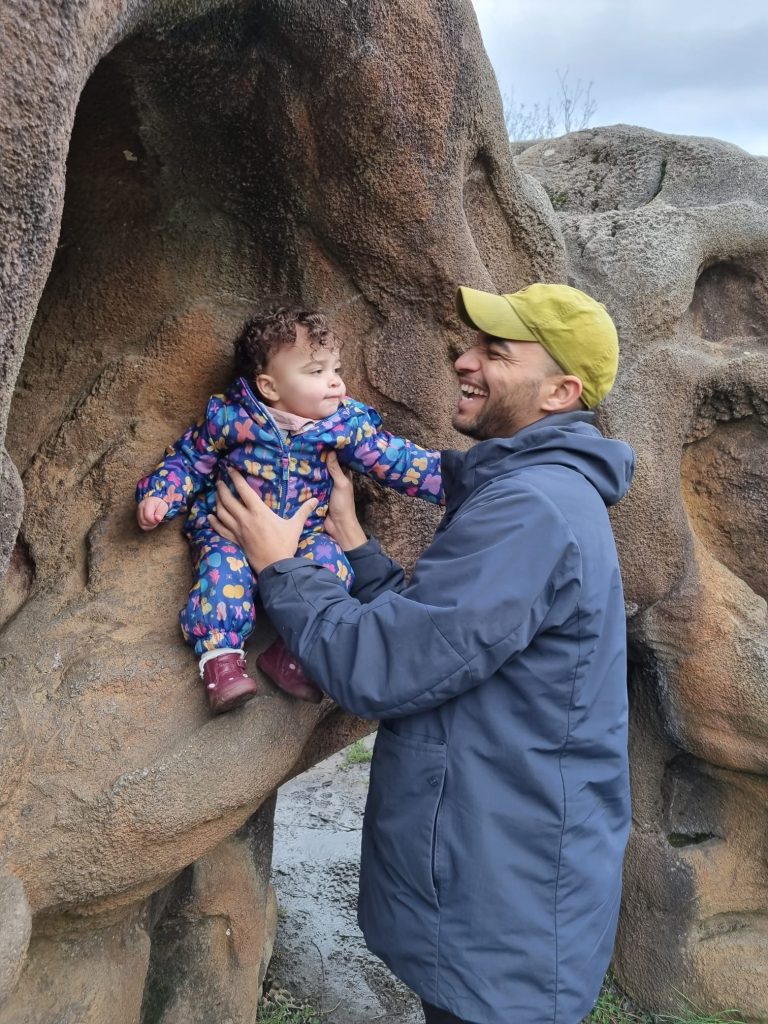 Recardo Mguty with his young child